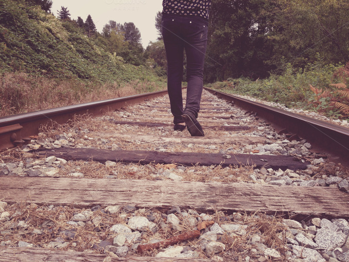 Walking on train tracks ~ People Photos on Creative Market