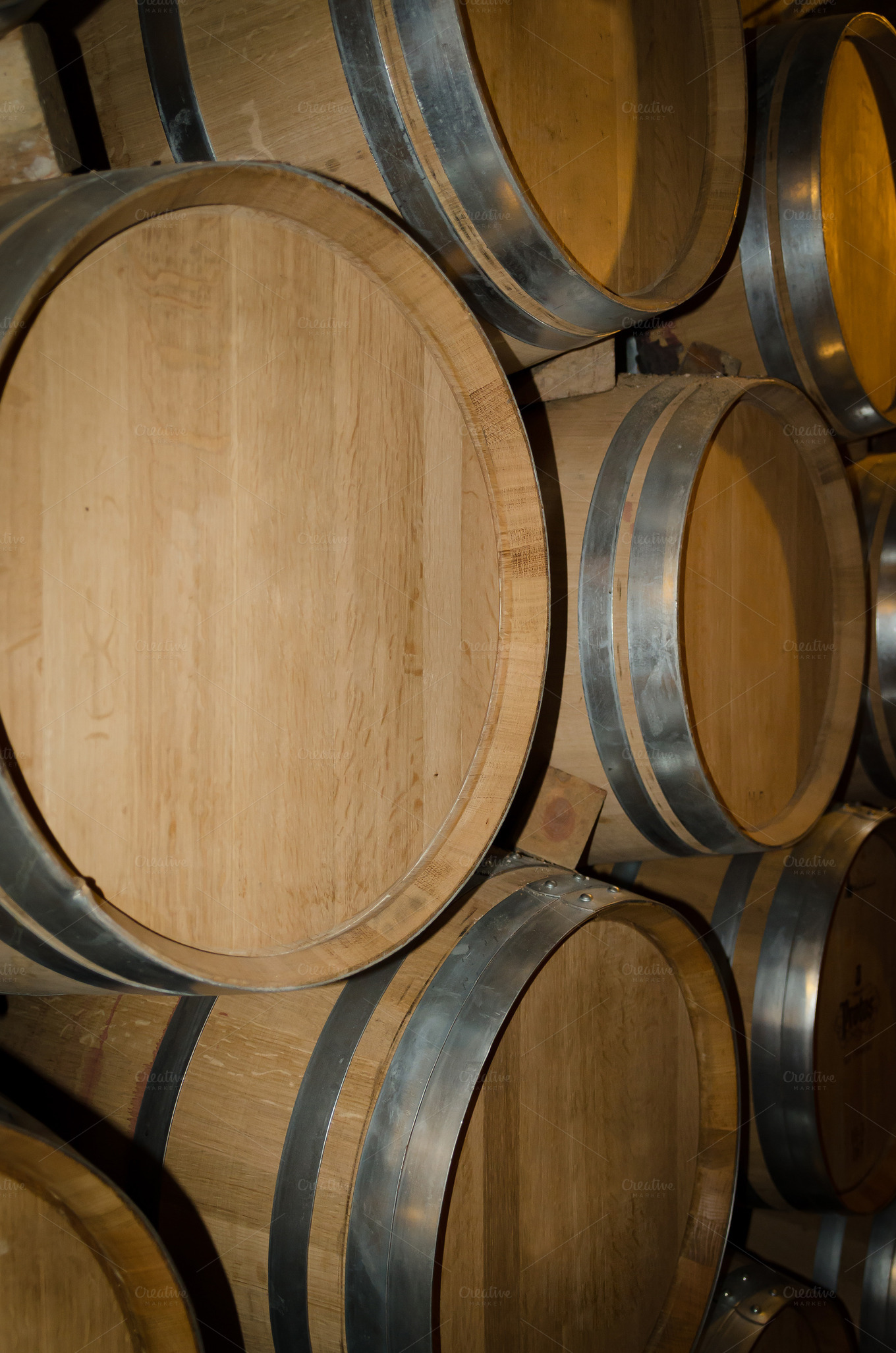 Stacked barrels in the winery ~ Food & Drink Photos on Creative Market