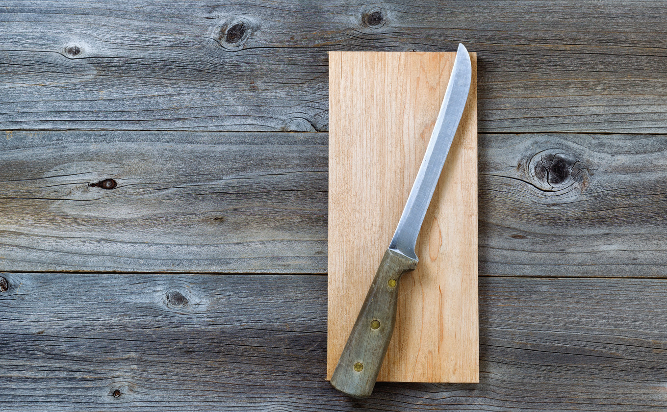Vintage knife on cutting board Industrial Photos on Creative Market