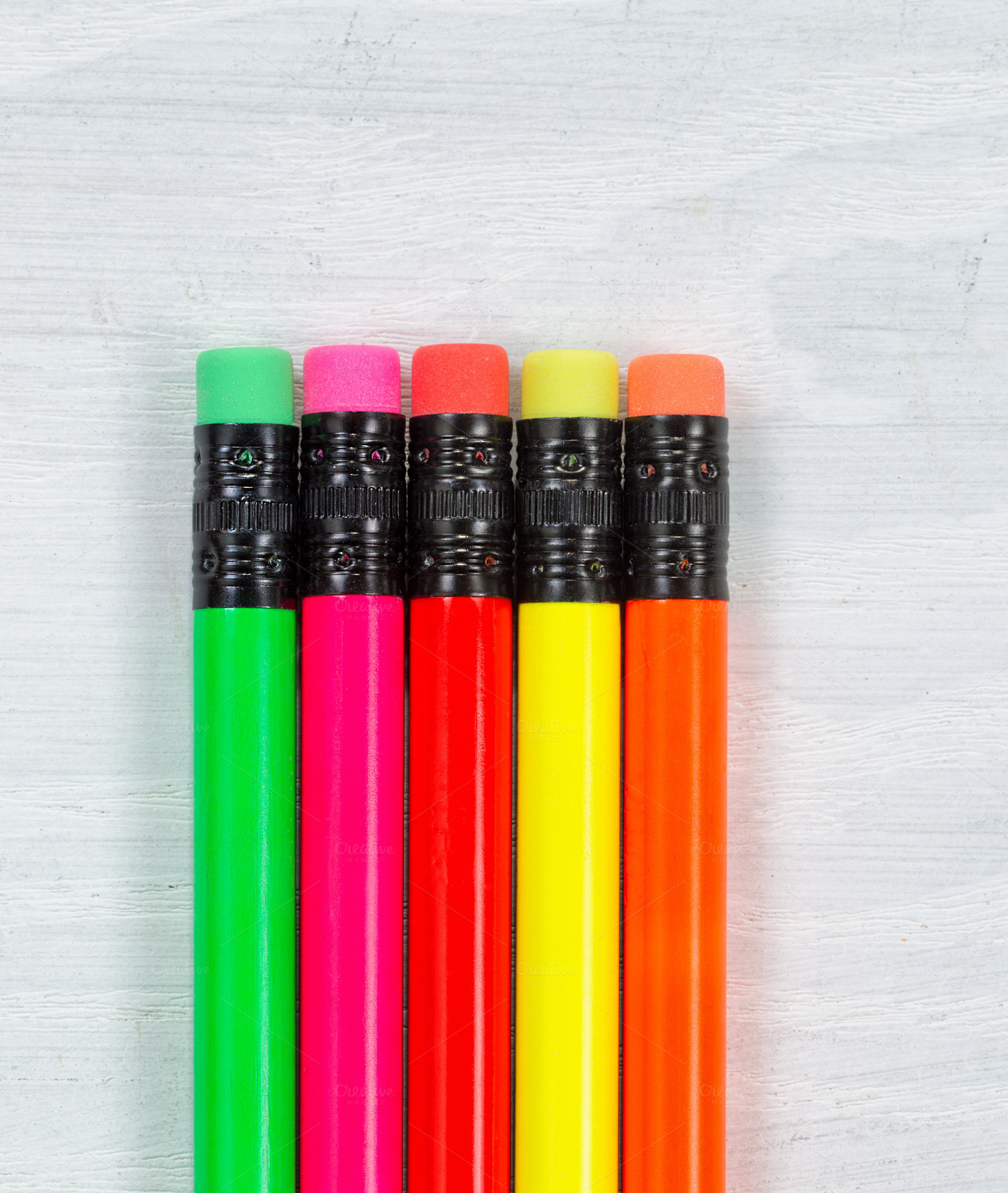 Colorful pencil tip erasers on wood Education Photos on Creative Market