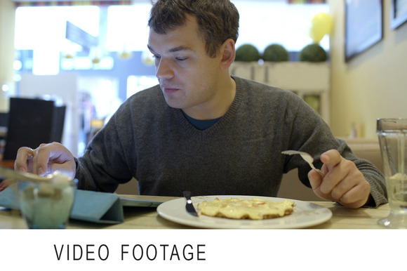 Man Using Pad And Having Dinner Man Using Pad And Having Dinner